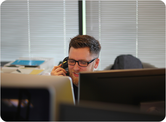 Customer support representative speaking on the phone
